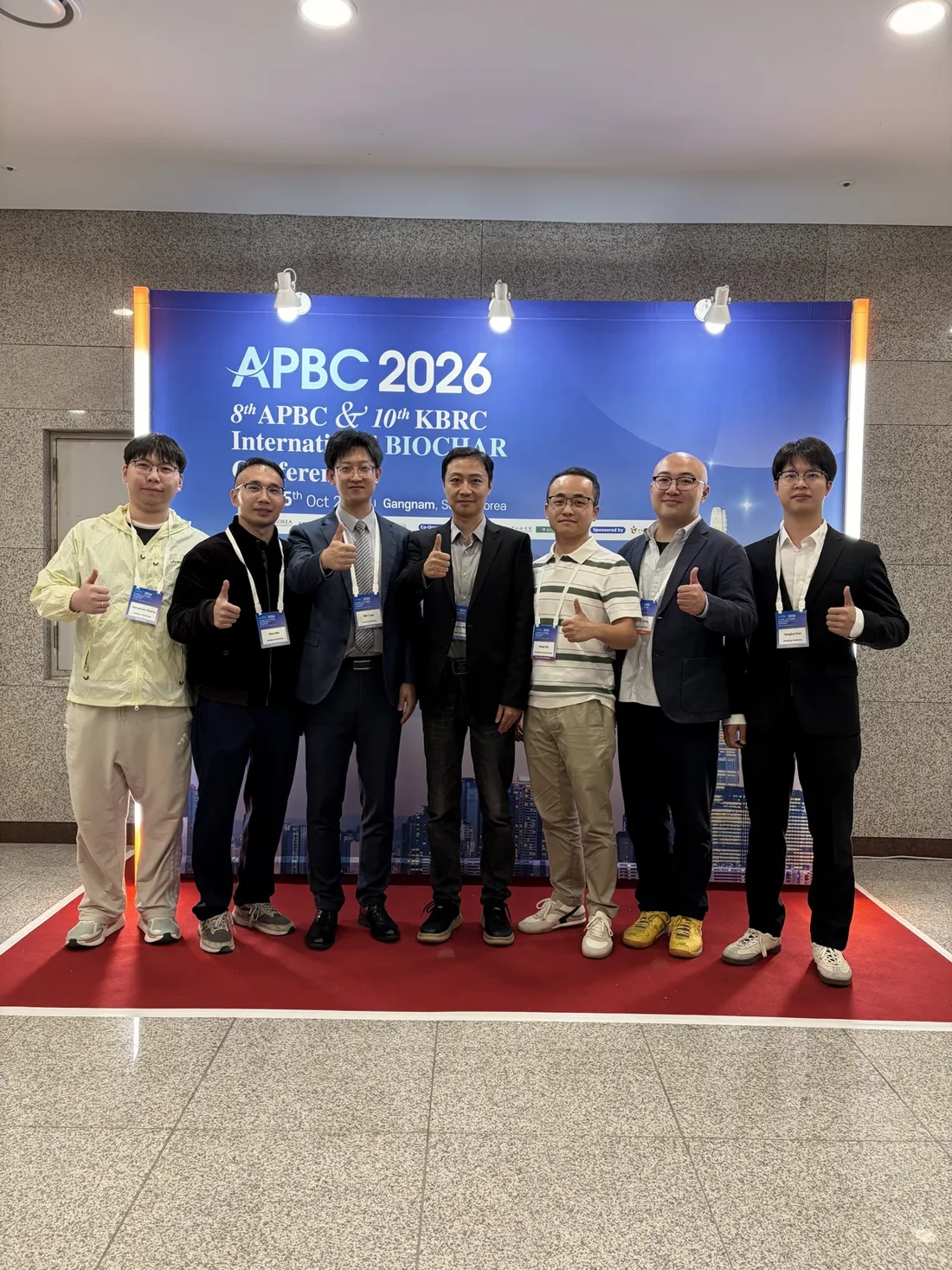 Participants at the APBC 2026 backdrop